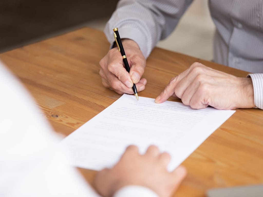 Man Writing Life Insurance Policy